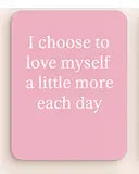Pink mouse pad with motivational quote on a pink background